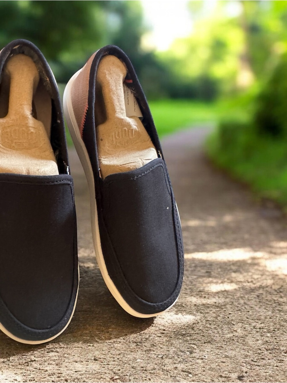 Hey Dude Women's Slip-On Flats in Black and Tan Accent